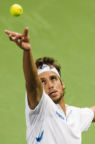 SHANGHAI, CHINA - OCTOBER 15:  Feliciano Lopez of Spain serves to  Jurgen Melzer of Austria during day five of 2009 Shanghai ATP Masters 1000 at Qi Zhong Tennis Centre on October 15, 2009 in Shanghai, China.  <br /><br /><span class="help">(Photo by Victor Fraile/Getty Images)</span>