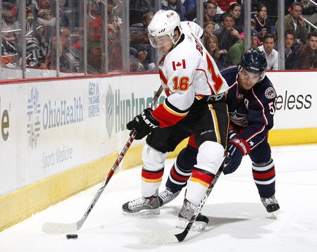 COLUMBUS, OH - OCTOBER 13: Dustin Boyd #16 of the Calgary Flames tries to control the puck in front of Antoine Vermette #50 of the Columbus Blue Jackets on October 13, 2009 at Nationwide Arena in Columbus, Ohio. Columbus won the game 2-1.  <br /><br /><span class="help">(Photo by Gregory Shamus/Getty Images)</span>