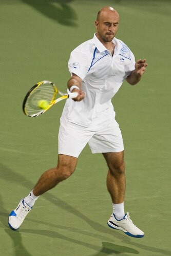 SHANGHAI, CHINA - OCTOBER 15: Ivan Ljubicic of Croatia returns a ball to Gael Monfils of France during day five of 2009 Shanghai ATP Masters 1000 at Qi Zhong Tennis Centre on October 15, 2009 in Shanghai, China.  <br /><br /><span class="help">(Photo by Victor Fraile/Getty Images)</span>