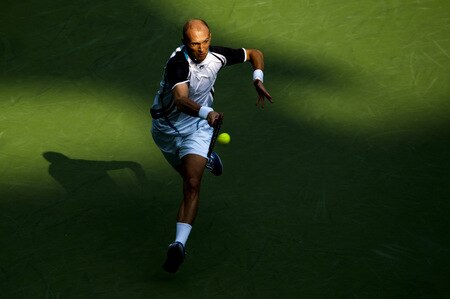 SHANGHAI, CHINA - OCTOBER 15:  Nikolay Davydenko of Russia returns a shot to Fernando Gonzalez of Chile during day five of 2009 Shanghai ATP Masters 1000 at Qi Zhong Tennis Centre on October 15, 2009 in Shanghai, China.  <br /><br /><span class="help">(Photo by Victor Fraile/Getty Images)</span>