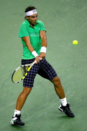 SHANGHAI, CHINA - OCTOBER 15:  Rafael Nadal of Spain returns a shot to Tommy Robredo of Spain during day five of the 2009 Shanghai ATP Masters 1000 at Qi Zhong Tennis Centre on October 15, 2009 in Shanghai, China.  <br /><br /><span class="help">(Photo by Matthew Stockman/Getty Images)</span>