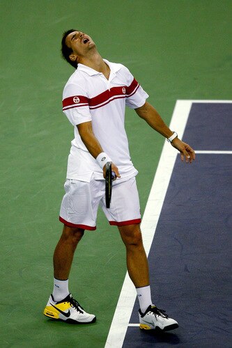 SHANGHAI, CHINA - OCTOBER 15:  Tommy Robredo of Spain reacts to a lost point to Rafael Nadal of Spain during day five of the 2009 Shanghai ATP Masters 1000 at Qi Zhong Tennis Centre on October 15, 2009 in Shanghai, China.  <br /><br /><span class="help">(Photo by Matthew Stockman/Getty Images)</span>