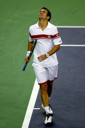 SHANGHAI, CHINA - OCTOBER 15:  Tommy Robredo of Spain reacts to a lost point to Rafael Nadal of Spain during day five of the 2009 Shanghai ATP Masters 1000 at Qi Zhong Tennis Centre on October 15, 2009 in Shanghai, China.  <br /><br /><span class="help">(Photo by Matthew Stockman/Getty Images)</span>