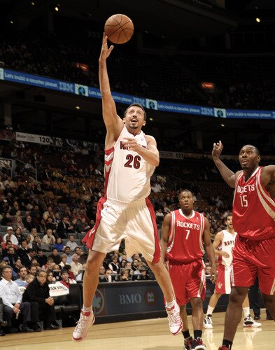 TORONTO - OCTOBER 15: Hedo Turkoglu #26  of the Toronto Raptors tries the layup next to defender Joey Dorsey #15of the Houston Rockets during a game on October 15, 2009 at the Air Canada Centre in Toronto, Ontario, Canada.  <br /><br /><span class="help">(Photo by Ron Turenne/NBAE via Getty Images)</span>