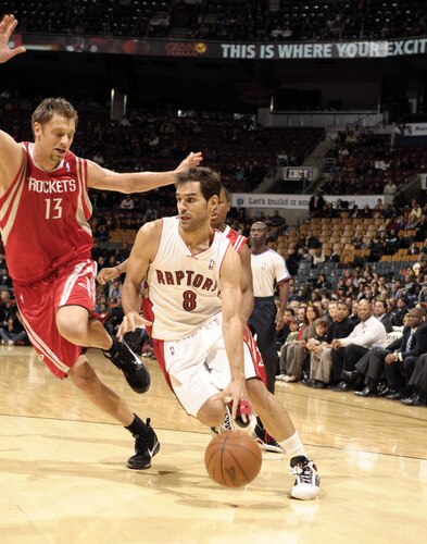 TORONTO - OCTOBER 15: Jose Calderon #8  of the Toronto Raptors drives to the hoop past defender David Anderson #13 of the Houston Rockets during a game on October 15, 2009 at the Air Canada Centre in Toronto, Ontario, Canada.  <br /><br /><span class="help">(Photo by Ron Turenne/NBAE via Getty Images)</span>
