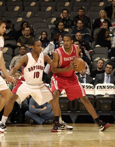 TORONTO - OCTOBER 15:Trevor Ariza #1 of the Houston Rockets looks to back down defender DeMar DeRozan #10 of Toronto Raptors during a game on October 15, 2009 at the Air Canada Centre in Toronto, Ontario, Canada.  <br /><br /><span class="help">(Photo by Ron Turenne/NBAE via Getty Images)</span>