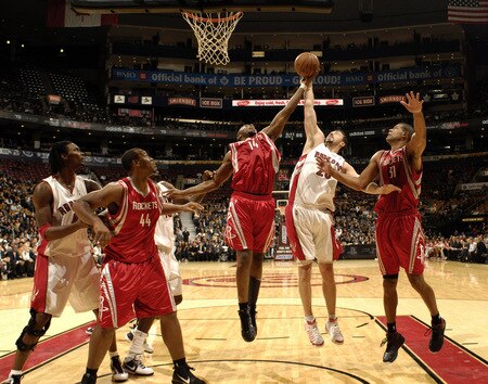TORONTO - OCTOBER 15:  Hedo Turkoglu #26 of the Toronto Raptors fights for the rebound under the basket with Carl Landry #14 of the Houston Rockets during a game on October 15, 2009 at the Air Canada Centre in Toronto, Ontario, Canada.  <br /><br /><span class="help">(Photo by Ron Turenne/NBAE via Getty Images)</span>