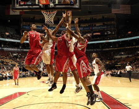 TORONTO - OCTOBER 15:  Trevor Ariza #1 of the Houston Rockets gets up high with his teammates in their attempt to grab a board during a game against the Toronto Raptors on October 15, 2009 at the Air Canada Centre in Toronto, Ontario, Canada.  <br /><br /><span class="help">(Photo by Ron Turenne/NBAE via Getty Images)</span>