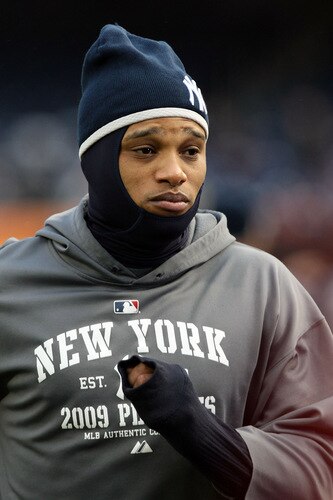 NEW YORK, NY - OCTOBER 16:  Robinson Cano #24 of the New York Yankees warms up before playing against the Los Angeles Angels of Anaheim in Game One of the ALCS during the 2009 MLB Playoffs at Yankee Stadium on October 16, 2009 in New York, New York.  <br /><br /><span class="help">(Photo by Nick Laham/Getty Images)</span>