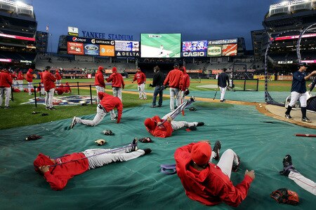 NEW YORK, NY - OCTOBER 16: The Los Angeles Angels of Anaheim stretch prior to the start of Game One of the ALCS against the New York Yankees during the 2009 MLB Playoffs at Yankee Stadium on October 16, 2009 in New York, New York.  <br /><br /><span class="help">(Photo by Jim McIsaac/Getty Images)</span>