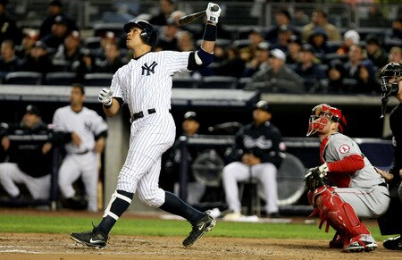 NEW YORK - OCTOBER 16:  Alex Rodriguez #13 of the New York Yankees hits a sacrifice fly to center field driving in Derek Jeter #2 in the first inning against of the Los Angeles Angels of Anaheim in Game One of the ALCS during the 2009 MLB Playoffs at Yankee Stadium on October 16, 2009 in New York, New York.  <br /><br /><span class="help">(Photo by Al Bello/Getty Images)</span>