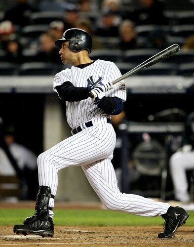 NEW YORK - OCTOBER 16:  Derek Jeter #2 of the New York Yankees hits a single in the first inning against of the Los Angeles Angels of Anaheim in Game One of the ALCS during the 2009 MLB Playoffs at Yankee Stadium on October 16, 2009 in New York, New York.  <br /><br /><span class="help">(Photo by Al Bello/Getty Images)</span>