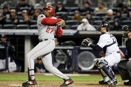 NEW YORK - OCTOBER 16:  Vladimir Guerrero #27 of the Los Angeles Angels of Anaheim lines out to right field against the New York Yankees in Game One of the ALCS during the 2009 MLB Playoffs at Yankee Stadium on October 16, 2009 in New York, New York.  <br /><br /><span class="help">(Photo by Al Bello/Getty Images)</span>
