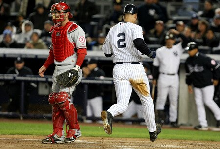 NEW YORK - OCTOBER 16:  Derek Jeter #2 of the New York Yankees scores when Alex Rodriguez #13 hits a sacrifice fly to center field against of the Los Angeles Angels of Anaheim in Game One of the ALCS during the 2009 MLB Playoffs at Yankee Stadium on October 16, 2009 in New York, New York.  <br /><br /><span class="help">(Photo by Al Bello/Getty Images)</span>