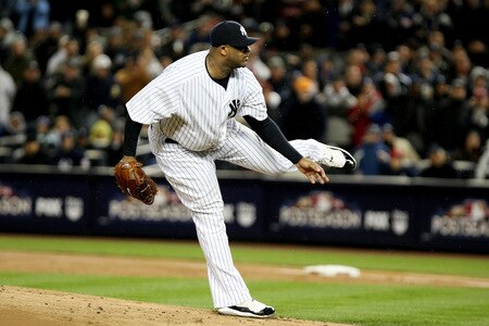 NEW YORK - OCTOBER 16:  CC Sabathia #52 of the New York Yankees throws a pitch against the Los Angeles Angels of Anaheim in Game One of the ALCS during the 2009 MLB Playoffs at Yankee Stadium on October 16, 2009 in New York, New York.  <br /><br /><span class="help">(Photo by Al Bello/Getty Images)</span>