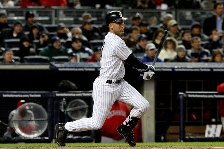 NEW YORK - OCTOBER 16:  Derek Jeter #2 of the New York Yankees hits a single in the first inning against of the Los Angeles Angels of Anaheim in Game One of the ALCS during the 2009 MLB Playoffs at Yankee Stadium on October 16, 2009 in New York, New York.  <br /><br /><span class="help">(Photo by Jim McIsaac/Getty Images)</span>