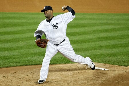 NEW YORK - OCTOBER 16:  CC Sabathia #52 of the New York Yankees pitches against the Los Angeles Angels of Anaheim in the first inning of Game One of the ALCS during the 2009 MLB Playoffs at Yankee Stadium on October 16, 2009 in New York, New York.  <br /><br /><span class="help">(Photo by Nick Laham/Getty Images)</span>