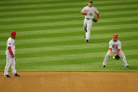 NEW YORK - OCTOBER 16:  Erick Aybar #2 of the Los Angeles Angels of Anaheim (R) lets a fly ball drop while Juan Rivera #20 (C) and Chone Figgins #9 (L) look on in the first inning of Game One of the ALCS during the 2009 MLB Playoffs at Yankee Stadium on October 16, 2009 in New York, New York.  <br /><br /><span class="help">(Photo by Nick Laham/Getty Images)</span>