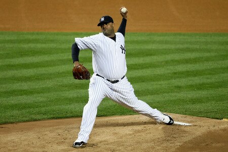NEW YORK - OCTOBER 16:  CC Sabathia #52 of the New York Yankees pitches against the Los Angeles Angels of Anaheim in the first inning of Game One of the ALCS during the 2009 MLB Playoffs at Yankee Stadium on October 16, 2009 in New York, New York.  <br /><br /><span class="help">(Photo by Nick Laham/Getty Images)</span>