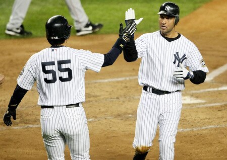 NEW YORK - OCTOBER 16:  Derek Jeter #2 of the New York Yankees celebrates scoring with Hideki Matsui #55 in the first inning against of the Los Angeles Angels of Anaheim in Game One of the ALCS during the 2009 MLB Playoffs at Yankee Stadium on October 16, 2009 in New York, New York.  <br /><br /><span class="help">(Photo by Nick Laham/Getty Images)</span>