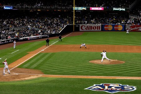 NEW YORK - OCTOBER 16:  CC Sabathia #52 of the New York Yankees (R) pitches against Bobby Abreu #53 of the Los Angeles Angels of Anaheim (L) in Game One of the ALCS during the 2009 MLB Playoffs at Yankee Stadium on October 16, 2009 in New York, New York.  <br /><br /><span class="help">(Photo by Nick Laham/Getty Images)</span>