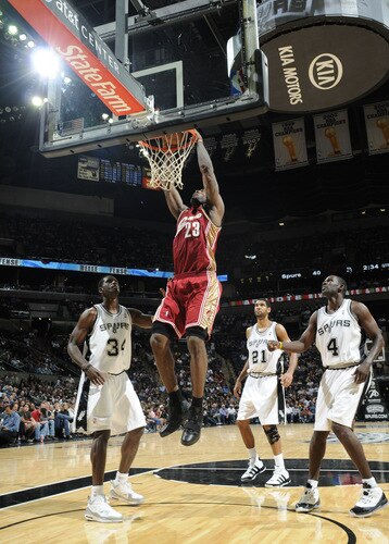 SAN ANTONIO - OCTOBER 16: LeBron James #23 of the Cleveland Cavaliers slam dunks the ball past Antonio McDyess #34, Tim Duncan #21, and Michael Finley #4 of the San Antonio Spurs on October 16, 2009 at the AT&T Center in San Antonio, Texas. <br /><br /><span class="help">(Photo by D. Clarke Evans/NBAE via Getty Images)</span>