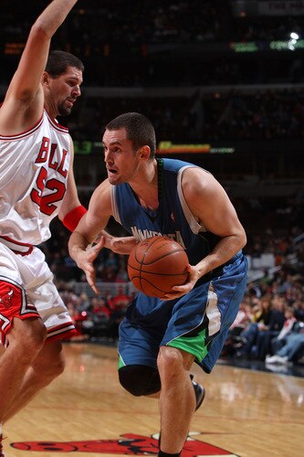 CHICAGO - OCTOBER 16:  Kevin Love #42 of the Minnesota Timberwolves drives against Brad Miller #52 of the Chicago Bulls at the United Center on October 16, 2009 in Chicago, Illinois.  <br /><br /><span class="help">(Photo by Gary Dineen/NBAE via Getty Images)</span>