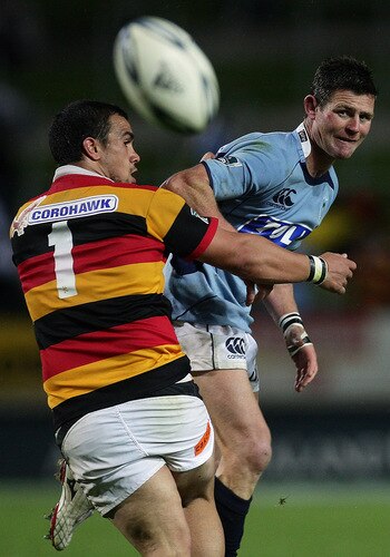 HAMILTON, NEW ZEALAND - OCTOBER 17:  David Holwell of Northland kicks the ball through past Hikairo Forbes of Waikato during the Air New Zealand Cup match between Waikato and Northland at Waikato Stadium on October 17, 2009 in Hamilton, New Zealand.  <br /><br /><span class="help">(Photo by Hannah Johnston/Getty Images)</span>