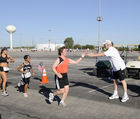 SAN ANTONIO - OCTOBER 17: Gregg Popovich, Head Coach the San Antonio Spurs encourages runners during the Spurs Fast Break 5K on October 17, 2009 in San Antonio, Texas. <br /><br /><span class="help">(Photo by D. Clarke Evans/NBAE via Getty Images)</span>