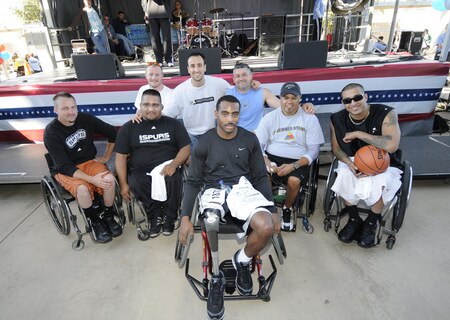 SAN ANTONIO - OCTOBER 17: The San Antonio Spurs Manu Ginobili poses with the wheelchair winners after the Spurs Fast Break 5K on October 17, 2009 in San Antonio, Texas. <br /><br /><span class="help">(Photo by D. Clarke Evans/NBAE via Getty Images)</span>