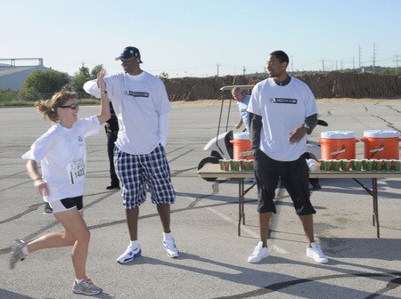 SAN ANTONIO - OCTOBER 17: The San Antonio Spurs Theo Ratliff (left) and Marcus Haislip encourages runners during the Spurs Fast Break 5K on October 17, 2009 in San Antonio, Texas. <br /><br /><span class="help">(Photo by D. Clarke Evans/NBAE via Getty Images)</span>