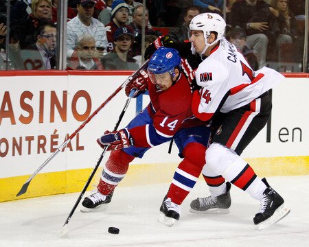kMONTREAL- OCTOBER 17:  Tomas Plekanec #14 of the Montreal Canadiens battles for the puck in the corner with Chris Campoli #14 of the Ottawa Senators during the NHL game on October 17, 2009 at the Bell Centre in Montreal, Quebec, Canada.  <br /><br /><span class="help">(Photo by Richard Wolowicz/Getty Images)</span>