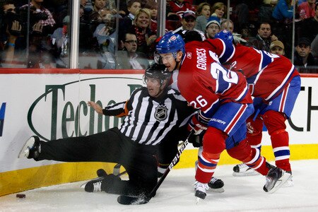 MONTREAL- OCTOBER 17:  NHL Official Dean Morton #36 gets knocked down by Josh Gorges #26 of the Montreal Canadiens during the NHL game against the Ottawa Senators on October 17, 2009 at the Bell Centre in Montreal, Quebec, Canada.  <br /><br /><span class="help">(Photo by Richard Wolowicz/Getty Images)</span>