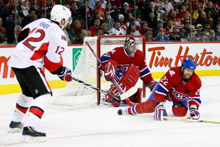 MONTREAL- OCTOBER 17:  Paul Mara #22 blocks the pass from Mike Fisher #12 of the Ottawa Senators during the NHL game on October 17, 2009 at the Bell Centre in Montreal, Quebec, Canada.  The Senators defeated the Canadiens 3-1.  <br /><br /><span class="help">(Photo by Richard Wolowicz/Getty Images)</span>