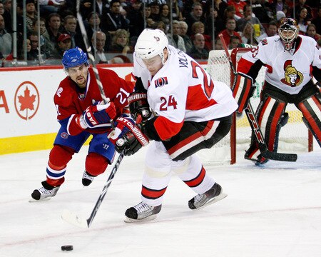 MONTREAL- OCTOBER 17:  Brian Gionta #21 of the Montreal Canadiens chases Anton Volchenkov #24 of the Ottawa Senators during the NHL game on October 17, 2009 at the Bell Centre in Montreal, Quebec, Canada.  The Senators defeated the Canadiens 3-1.  <br /><br /><span class="help">(Photo by Richard Wolowicz/Getty Images)</span>
