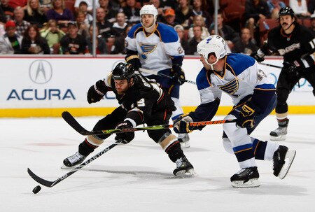 ANAHEIM, CA - OCTOBER 17:  Mike Brown #13 of the Anaheim Ducks lunges for the puck in front of Mike Weaver #43 of the St. Louis Blues in the first period at Honda Center on October 17, 2009 in Anaheim, California.  <br /><br /><span class="help">(Photo by Jeff Gross/Getty Images)</span>