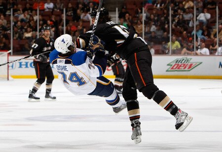 ANAHEIM, CA - OCTOBER 17:  T.J. Oshie #74 of the St. Louis Blues is hit by George Parros #16 of the Anaheim Ducks in the first period at Honda Center on October 17, 2009 in Anaheim, California.  <br /><br /><span class="help">(Photo by Jeff Gross/Getty Images)</span>