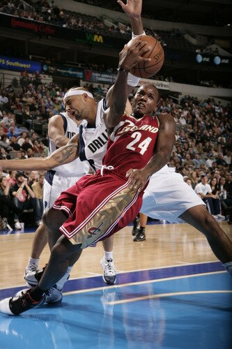 DALLAS - OCTOBER 17: Russell Robinson #24 of the Cleveland Cavaliers tries to get the shot off as he takes a tumble with Drew Gooden #90 of the Dallas Mavericks during a preseason game at the American Airlines Center on October 17, 2009 in Dallas, Texas. <br /><br /><span class="help">(Photo by Glenn James/NBAE via Getty Images)</span>