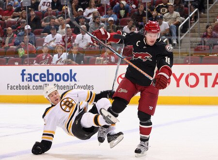 GLENDALE, AZ - OCTOBER 17:  Shane Doan #19 of the Phoenix Coyotes lays a body check onto Shawn Thornton #22 of the Boston Bruins during the NHL game at Jobing.com Arena on October 17, 2009 in Glendale, Arizona. The Coyotes defeated the Bruins 4-1.  <br /><br /><span class="help">(Photo by Christian Petersen/Getty Images)</span>