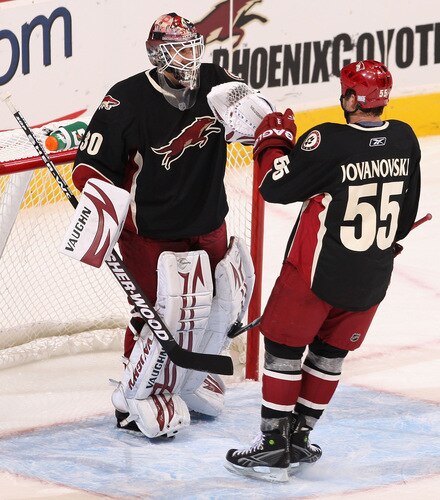 GLENDALE, AZ - OCTOBER 17:  Goaltender Ilya Bryzgalov #30 of the Phoenix Coyotes is congratulated by Ed Jovanovski #55 after defeating the Boston Bruins in the NHL game at Jobing.com Arena on October 17, 2009 in Glendale, Arizona.  The Coyotes defeated the Bruins 4-1. <br /><br /><span class="help">(Photo by Christian Petersen/Getty Images)</span>