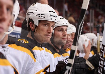 GLENDALE, AZ - OCTOBER 17:  Andrew Ference #21 of the Boston Bruins watches from the bench during the NHL game against the Phoenix Coyotes at Jobing.com Arena on October 17, 2009 in Glendale, Arizona. The Coyotes defeated the Bruins 4-1. <br /><br /><span class="help">(Photo by Christian Petersen/Getty Images)</span>