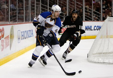 ANAHEIM, CA - OCTOBER 17:  Darryl Sydor #44 of the St. Louis Blues is pursued by George Parros #16 of the Anaheim Ducks for the puck in the third period at Honda Center on October 17, 2009 in Anaheim, California. The Blues defeated the Ducks 5-0.  <br /><br /><span class="help">(Photo by Jeff Gross/Getty Images)</span>