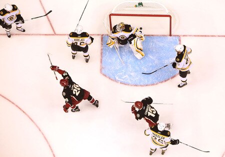GLENDALE, AZ - OCTOBER 17:  Robert Lang #20 and Matthew Lombardi #15 of the Phoenix Coyotes celebrate after Ed Jovanovski #55 scored a first period goal past goaltender Tim Thomas #30 of the Boston Bruins during the NHL game at Jobing.com Arena on October 17, 2009 in Glendale, Arizona. The Coyotes defeated the Bruins 4-1. <br /><br /><span class="help">(Photo by Christian Petersen/Getty Images)</span>