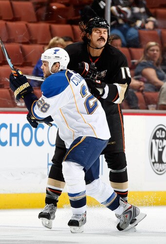 ANAHEIM, CA - OCTOBER 17:  Carlo Colaiacovo #28 of the St. Louis Blues is hit by George Parros #16 of the Anaheim Ducks in the third period at Honda Center on October 17, 2009 in Anaheim, California. The Blues defeated the Ducks 5-0.  <br /><br /><span class="help">(Photo by Jeff Gross/Getty Images)</span>