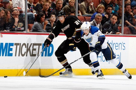 ANAHEIM, CA - OCTOBER 17:  Evgeny Artyukhin #24 of the Anaheim Ducks and David Perron #57 of the St. Louis Blues battle for the puck in the third period at Honda Center on October 17, 2009 in Anaheim, California. The Blues defeated the Ducks 5-0.  <br /><br /><span class="help">(Photo by Jeff Gross/Getty Images)</span>
