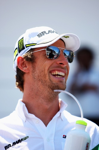 SAO PAULO, BRAZIL - OCTOBER 18:  Jenson Button of Great Britain and Brawn GP attends the drivers parade before the Brazilian Formula One Grand Prix at the Interlagos Circuit on October 18, 2009 in Sao Paulo, Brazil.  <br /><br /><span class="help">(Photo by Mark Thompson/Getty Images)</span>