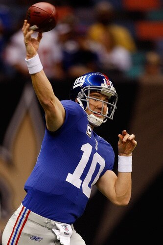 NEW ORLEANS - OCTOBER 18:  Quarterback Eli Manning #10 of the New York Giants warms up before playing the New Orleans Saints at the Louisiana Superdome on October 18, 2009 in New Orleans, Louisiana.  <br /><br /><span class="help">(Photo by Chris Graythen/Getty Images)</span>