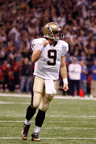 NEW ORLEANS - OCTOBER 18:  Drew Brees #9 of the New Orleans Saints celebrates after watching Mike Bell #21 score a touchdown against the New York Giants at the Louisiana Superdome on October 18, 2009 in New Orleans, Louisiana.  <br /><br /><span class="help">(Photo by Chris Graythen/Getty Images)</span>