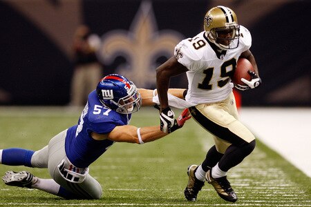 NEW ORLEANS - OCTOBER 18:  Devery Henderson #19 of the New Orleans Saints is pushed out of bounds by Chase Blackburn #57 of the New York Giants at the Louisiana Superdome on October 18, 2009 in New Orleans, Louisiana.  <br /><br /><span class="help">(Photo by Chris Graythen/Getty Images)</span>