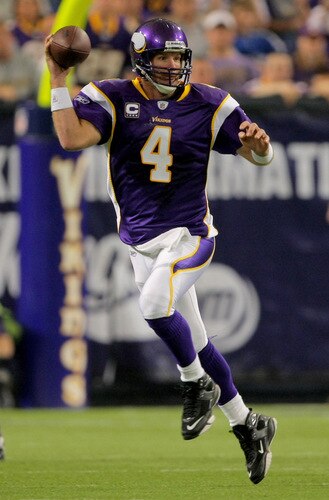 MINNEAPOLIS - OCTOBER 18:  Quarterback Brett Favre #4 of the Minnesota Vikings rolls out to deliver a pass against the Baltimore Ravens during NFL action at Hubert H. Humphrey Metrodome on October 18, 2009 in Minneapolis, Minnesota.  <br /><br /><span class="help">(Photo by Doug Pensinger/Getty Images)</span>
